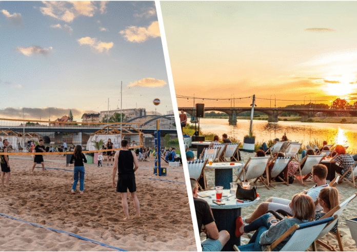 Na zdjęciu mecz siatkówki plażowej i widok na marinę kleczków