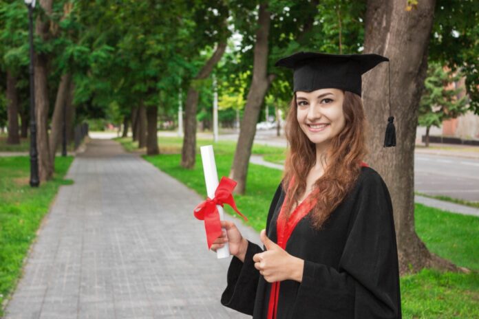 Happy woman on her graduation day University. Education and people